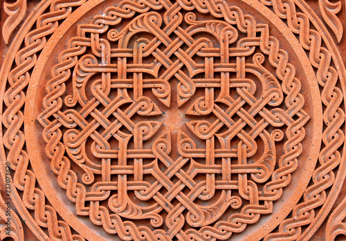 Traditional tufa stone carving ornament on a wall of Armenian Orthodox Church