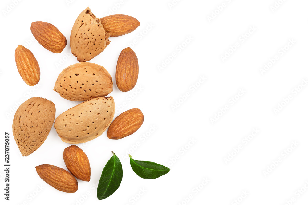 almonds with leaves isolated on white background with copy space for your text. Top view. Flat lay pattern almonds with leaves isolated on white background with copy space for your text. Top view. Flat lay pattern