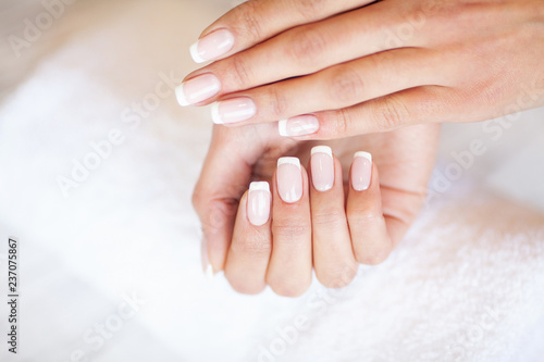Professional manicure procedure. Nails master doing manicure in beauty studio