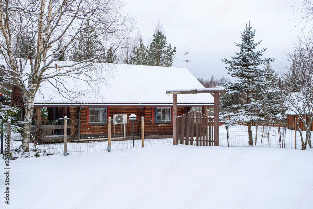 Log cabin in winter in Northern Europe Finland