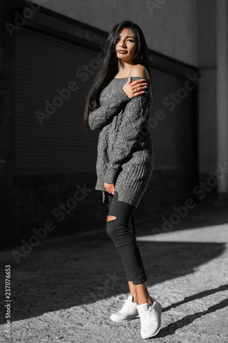 Beautiful model poses for the camera on the streets. © zadorozhna