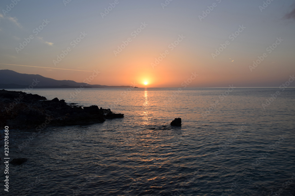 Golden hour Sundown, with view to Korfu island. Sunset on the beach in Ksamil near Saranda, Albania.