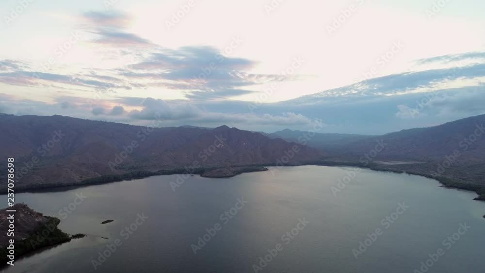 Aerial Forward Slow: Cloud Formations on Top of Komodo Island Mountains Aerial Forward Slow: Cloud Formations on Top of Komodo Island Mountains