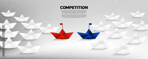 Battle of red and blue origami paper ship with group of white. Business Concept of competition and battle.