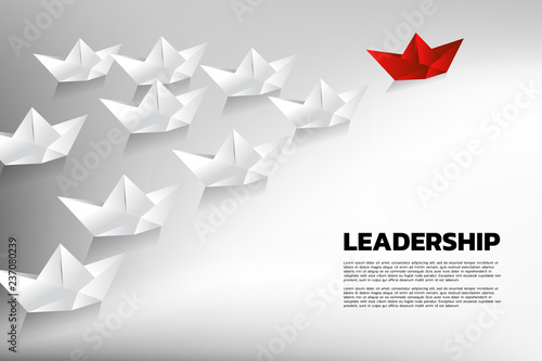 Fototapeta Naklejka Na Ścianę i Meble -  Red origami paper ship leading the group of white. Business Concept of team leadership.