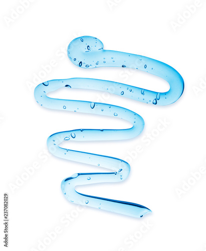 Trace of transparent gel with bubbles close-up on white background