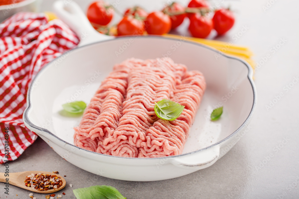 Fresh minced meat with spices on table Fresh minced meat with spices on table
