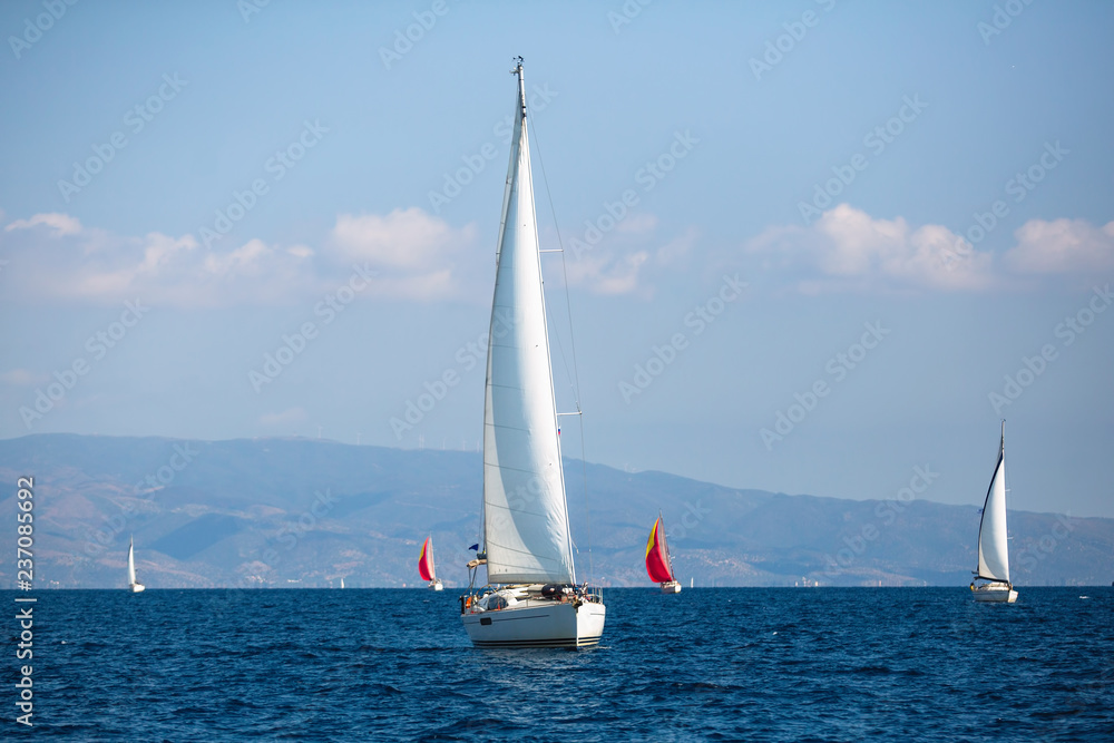 Sailing luxury boats during the yacht regatta in Aegean Sea, Greece.
