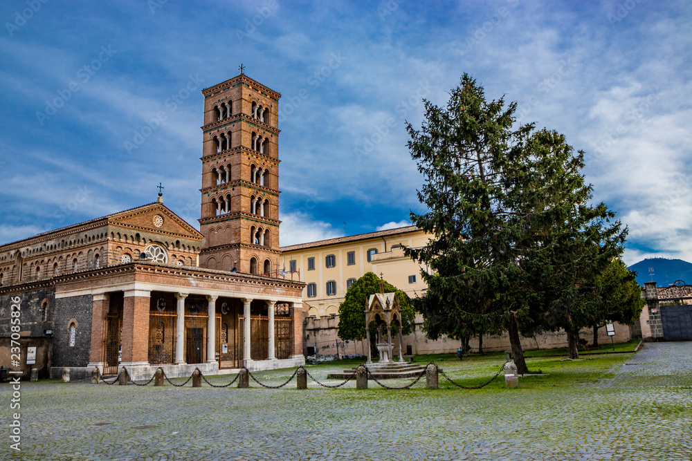 Obraz premium The church, the bell tower, and the liturgical fountain 