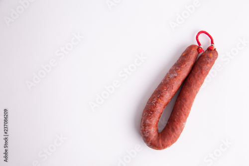 Food from spain, chorizo sausage slices or salami pepperoni, traditional spanish tapas, overhead.