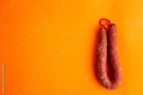 Food from spain, chorizo sausage slices or salami pepperoni, traditional spanish tapas, overhead.