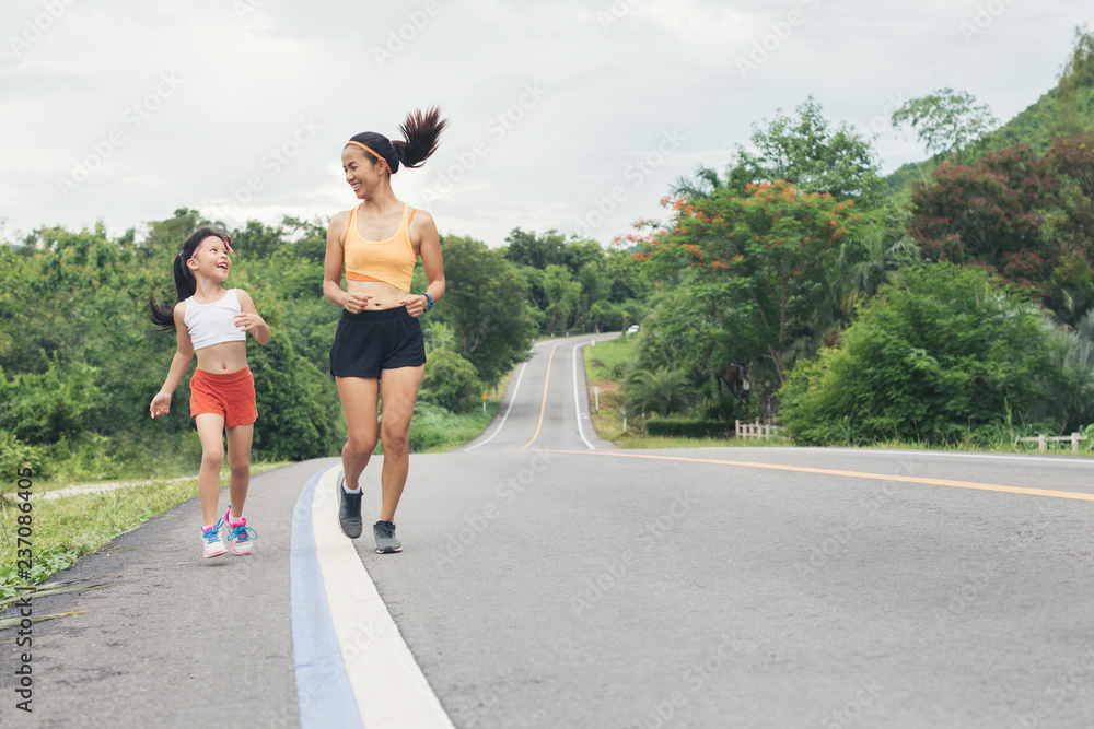 mother and daughter running jogging outdoor