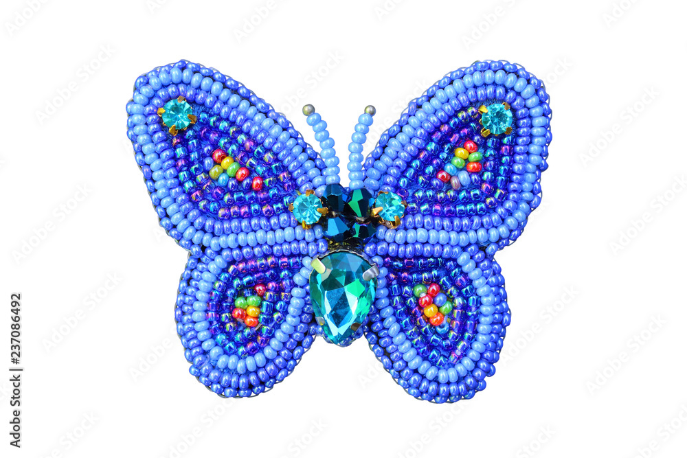 Brooch from beads a butterfly. Close-up. Isolated object on white background. Isolate. Brooch from beads a butterfly. Close-up. Isolated object on white background. Isolate.