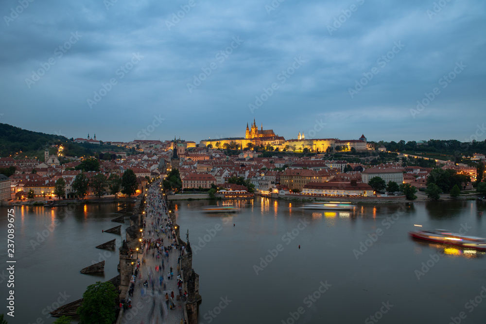 Prague, Czech Republic. Charles Bridge and Hradcany (Prague Castle) with St. Vitus Cathedral and St. George church evening dusk, Bohemia landmark in Praha.