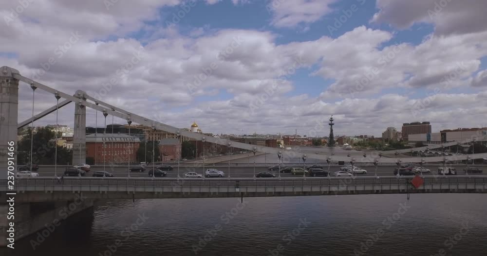 Aerial view of the central region in Moscow, Russia. Bridge over Moscow river, Gorky park, heavy traffic and boats crossing the river 4k Aerial view of the central region in Moscow, Russia. Bridge over Moscow river, Gorky park, heavy traffic and boats crossing the river 4k