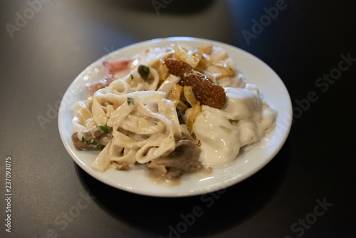 Italian pasta dish with carbonara sauce.
