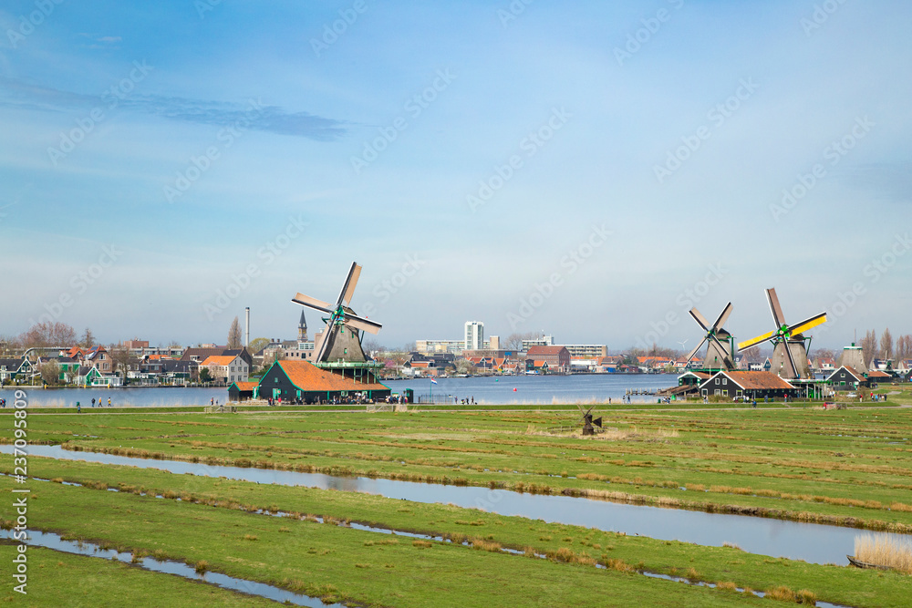 Landscape of well-preserved historic windmills and houses Landscape of well-preserved historic windmills and houses