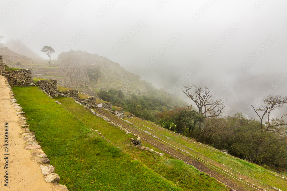 Machu Picchu maybe one of the most visited places in south america and it deserves it. Steep walls, impressive valleys and mountains surround the old city of the Inca Empire during a foggy morning