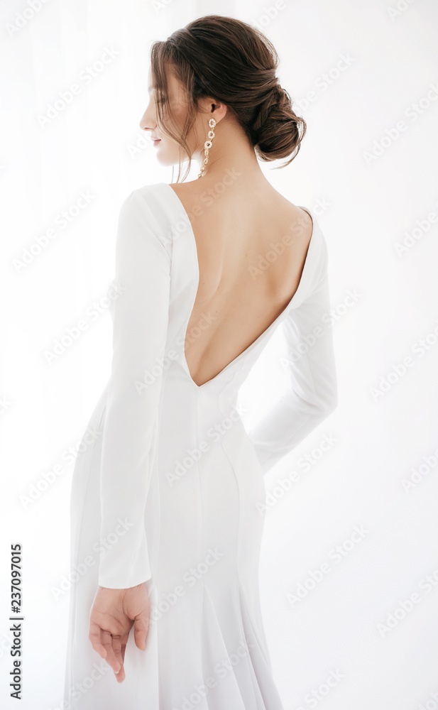 Beautiful brunette bride with stylish make-up in white dress Beautiful brunette bride with stylish make-up in white dress