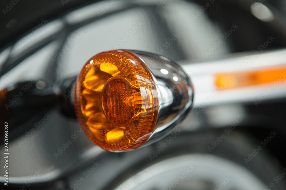 Obraz premium Orange marker bike light. Details of the motorcycle close-up.