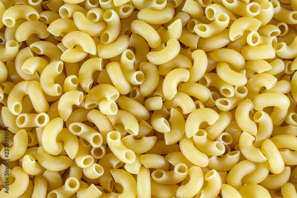 Pasta unprepared horns for all photos. Close-up Pasta unprepared horns for all photos. Close-up