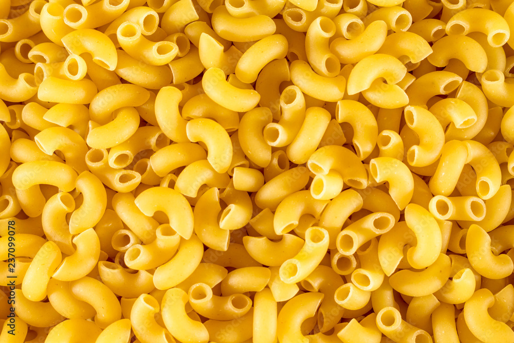 Pasta unprepared horns for all photos. Close-up Pasta unprepared horns for all photos. Close-up