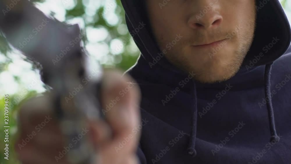 Pov of kidnapped person lying in trunk of car, murderer threatening with gun Pov of kidnapped person lying in trunk of car, murderer threatening with gun