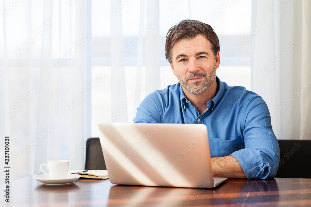 Portrait of a mature man having a little smile, on a curtains background Portrait of a mature man having a little smile, on a curtains background
