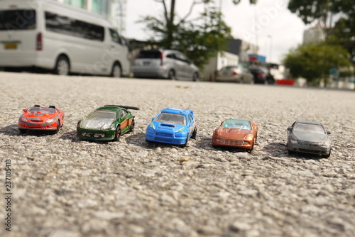 Toy cars on roads photo