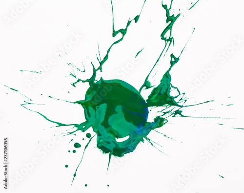 Green paint spot on paper, colorfull artistic image on white background photo