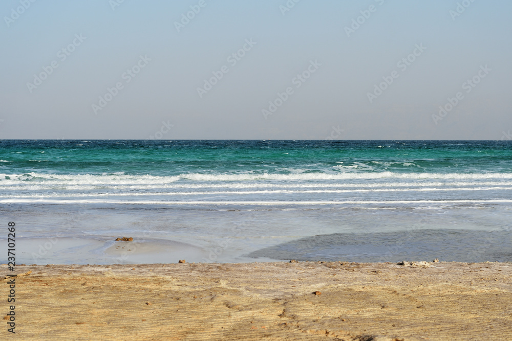 Dead Sea seashore in the evening in cloudy weather