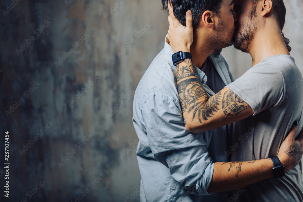 Romantic hot male same-sex couple enjoy togetherness, kiss each other,  feeling passion and desire. Mutual alternative love. Stock Photo | Adobe  Stock