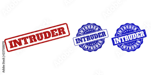 INTRUDER grunge stamp seals in red and blue colors. Vector INTRUDER overlays with dirty effect. Graphic elements are rounded rectangles, rosettes, circles and text captions.