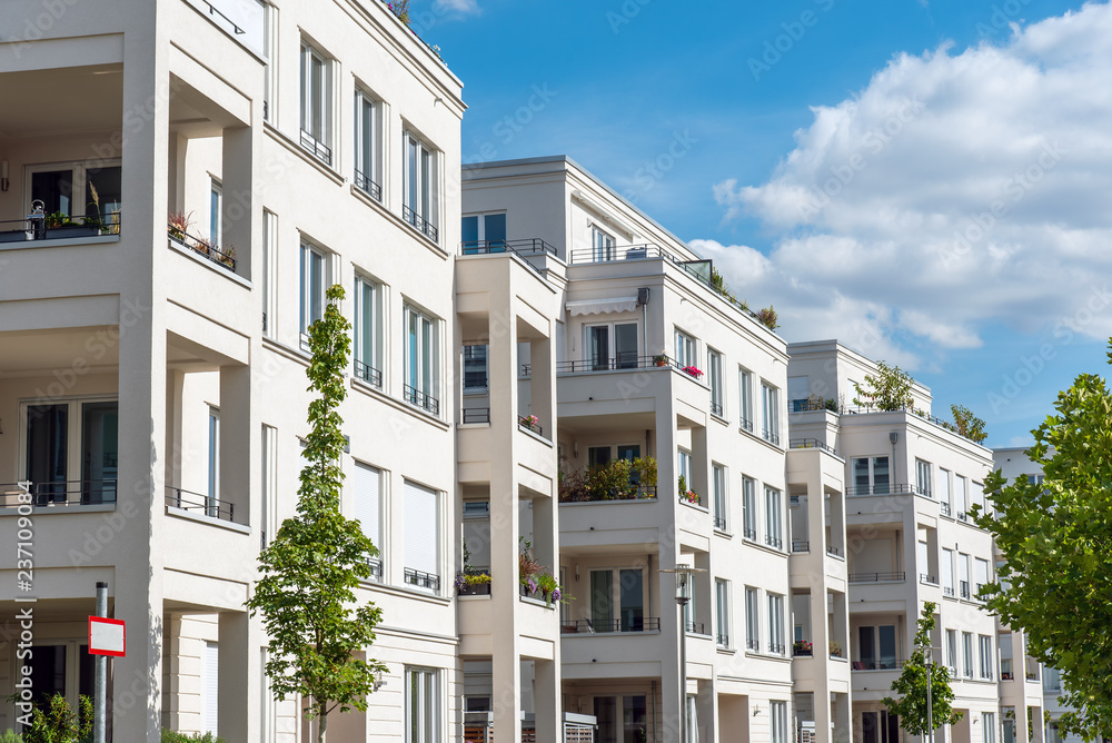 Naklejka premium Row of white modern apartment houses seen in Berlin, Germany