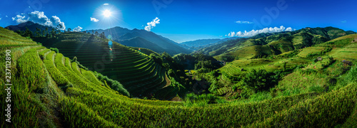 Rice fields on terraced with wooden pavilion on blue sky background in Mu Cang Chai, YenBai, Vietnam. photo