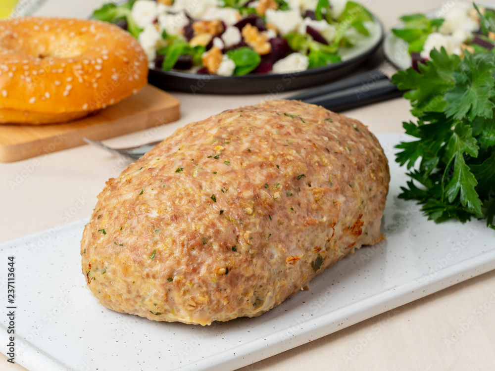 Terrine, meat loaf. Baked Turkey ground meat. Traditional French and American dish. Side view, white marble background Terrine, meat loaf. Baked Turkey ground meat. Traditional French and American dish. Side view, white marble background
