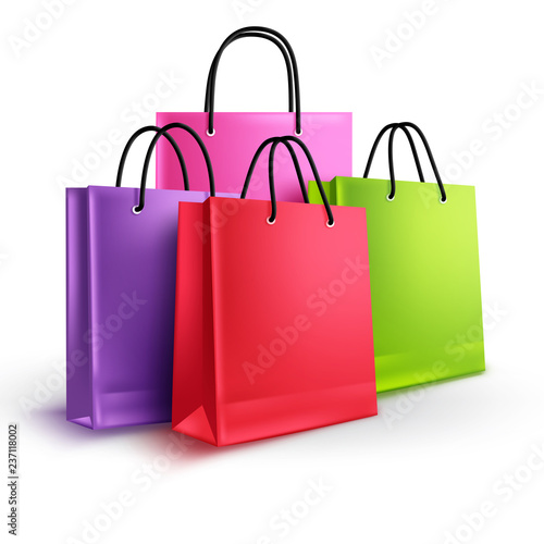 Shopping bags group vector concept. Empty paper bags with assorted colors for fashion and store design elements isolated in white background.