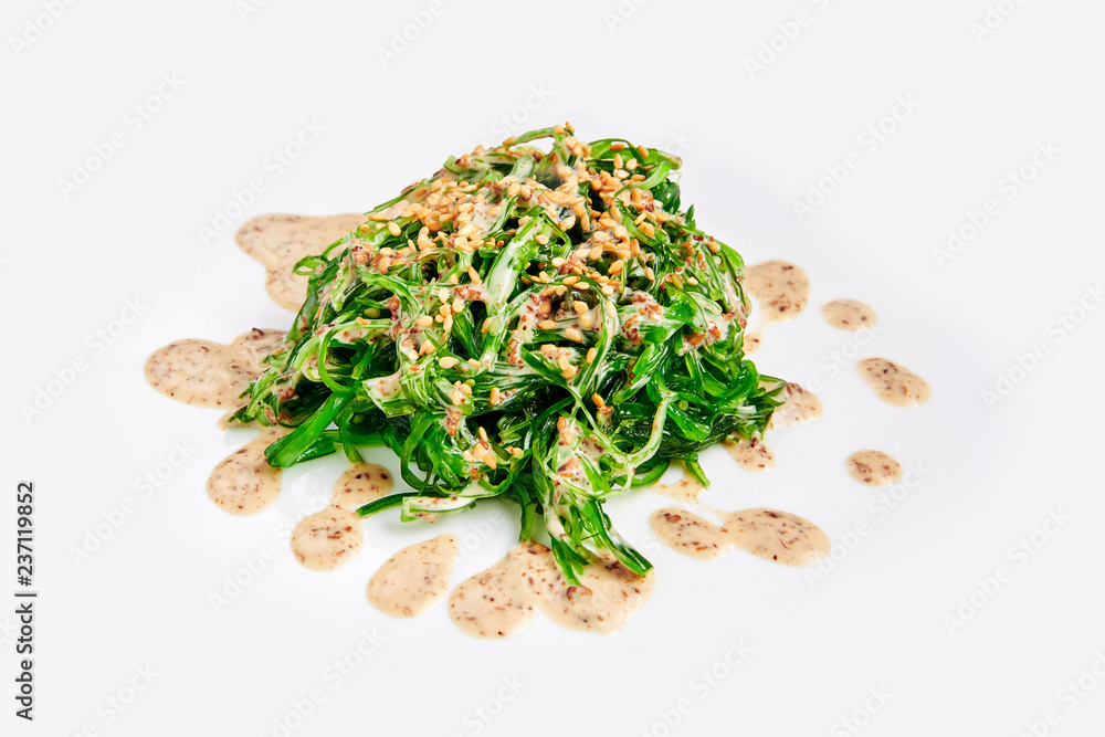 Fresh chuka seaweed salad isolated on white. Japanese cuisine. Fresh chuka seaweed salad isolated on white. Japanese cuisine.