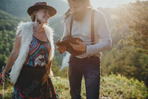 Sensual hipster couple in boho clothes in nature. Summer photo