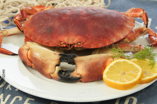 crab on plate with lemon and lemon
