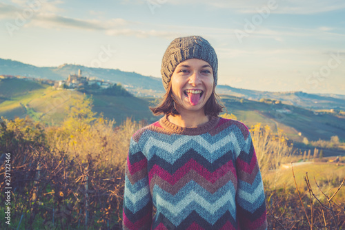 happy tourits girl in Serralunga d'Alba, Langhe wine area region in Piedmont, Italy photo