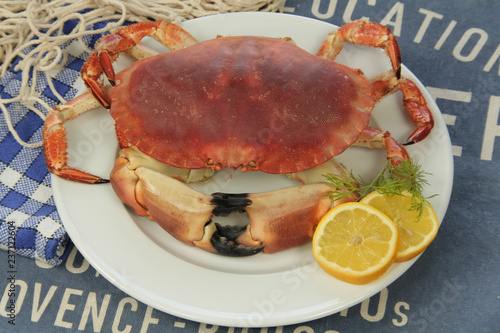 crab on plate with lemon and mint