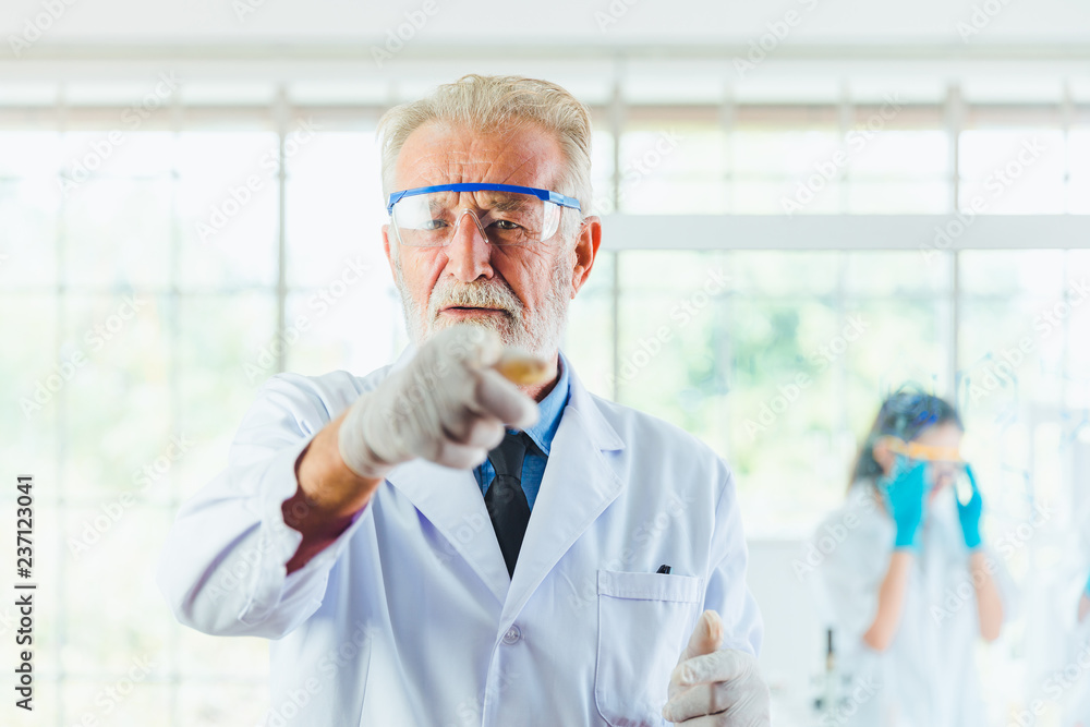 Portrait Science men working with chemicals in lab Portrait Science men working with chemicals in lab