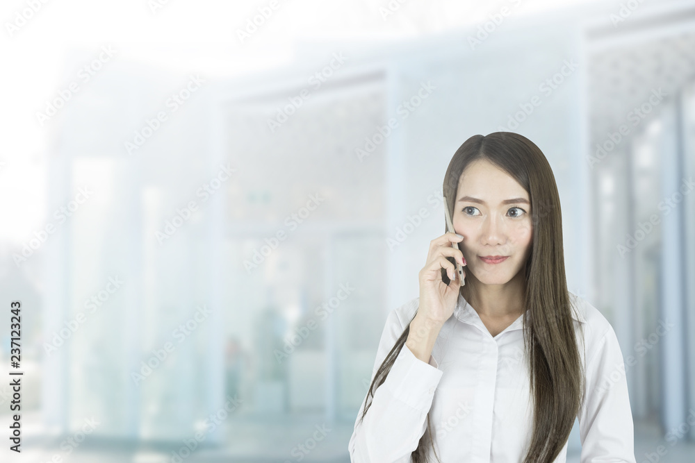 Asian business woman office worker communicating with mobile phone. Asian business woman office worker communicating with mobile phone.