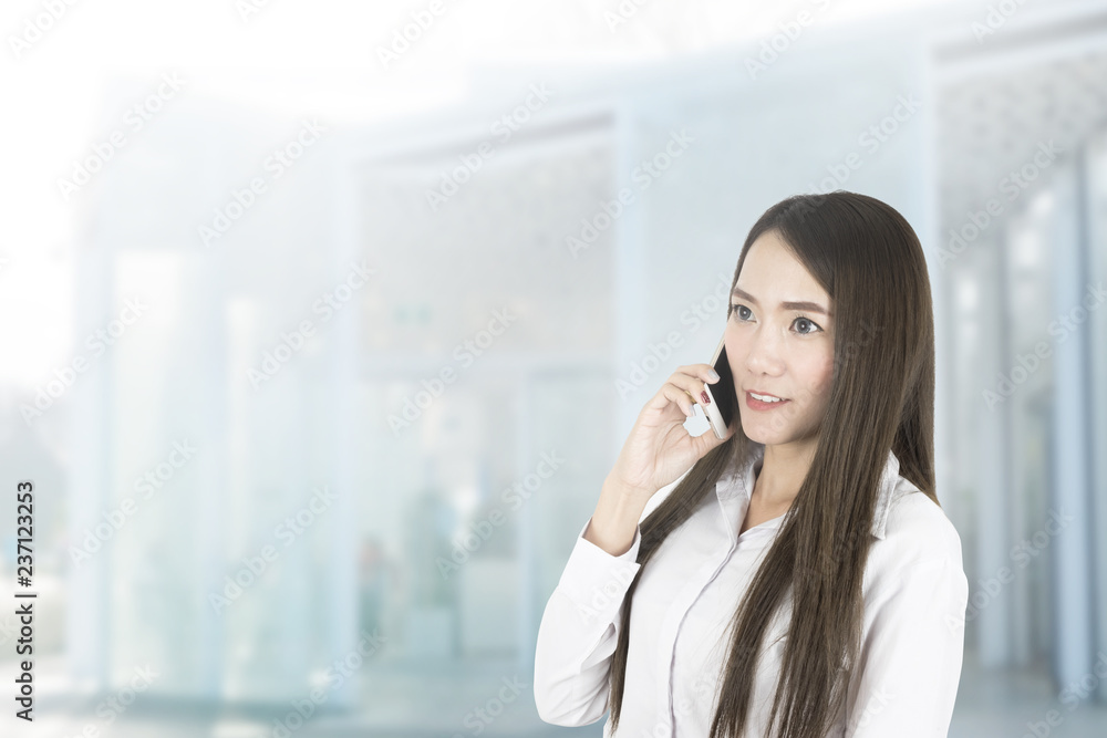 Asian business woman office worker communicating with mobile phone. Asian business woman office worker communicating with mobile phone.