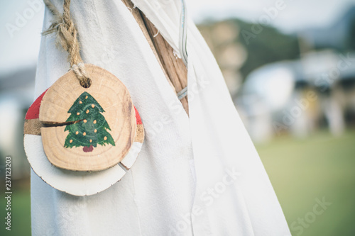 Top path of white indian tent with wood tag in front in the morning