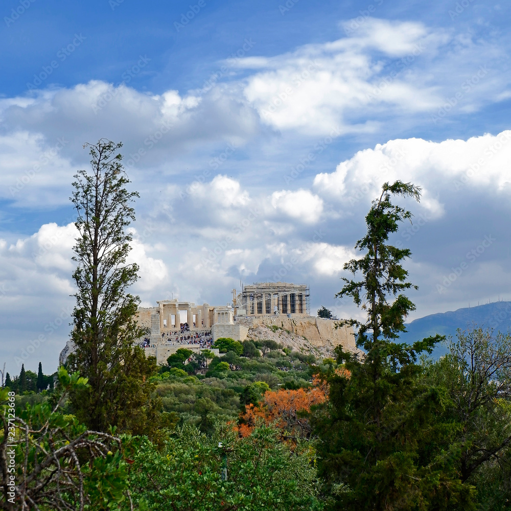 Acropolis of Athens Greece under a blue cloudy sky, view from Pnyx hill