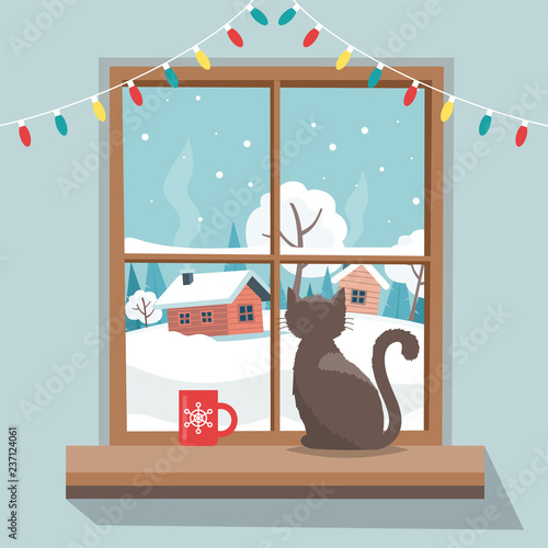 Christmas window with winter landscape, cat sitting on the window sill. Merry christmas greeting card template.