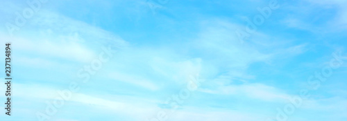 Beautiful blue sky with white fluffy clouds background. Turquoise color blured photography