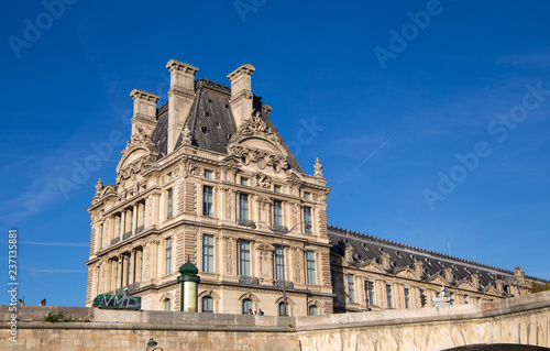 PARIS, FRANCE, SEPTEMBER 8, 2018 - Particular of facade of Louvre Museum, one of the most famous museums in the world, Paris, France